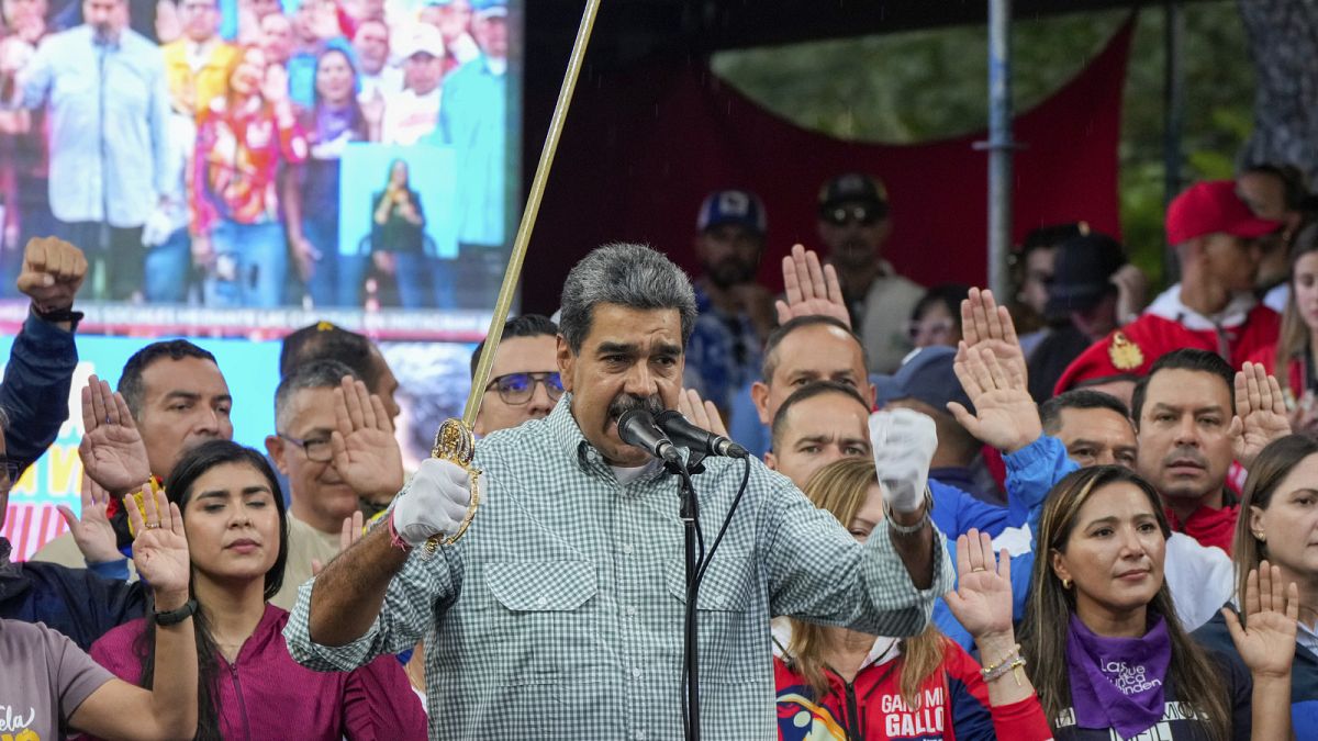 Venezuela's President Nicolás Maduro brandishes a sword as his new Cabinet takes the oath of office, at the presidential palace in Caracas, Venezuela, Wednesday, Aug. 28, 2024 Venezuela's President Nicolás Maduro brandishes a sword as his new Cabinet takes the oath of office, at the presidential palace in Caracas, Venezuela, Wednesday, Aug. 28, 2024